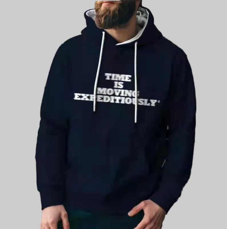 Person wearing a navy blue hoodie with text 'TIME IS MOVING EXPEDENTIALLY' against a grid background