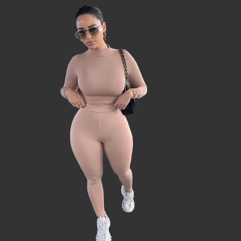 Woman in a beige outfit.
