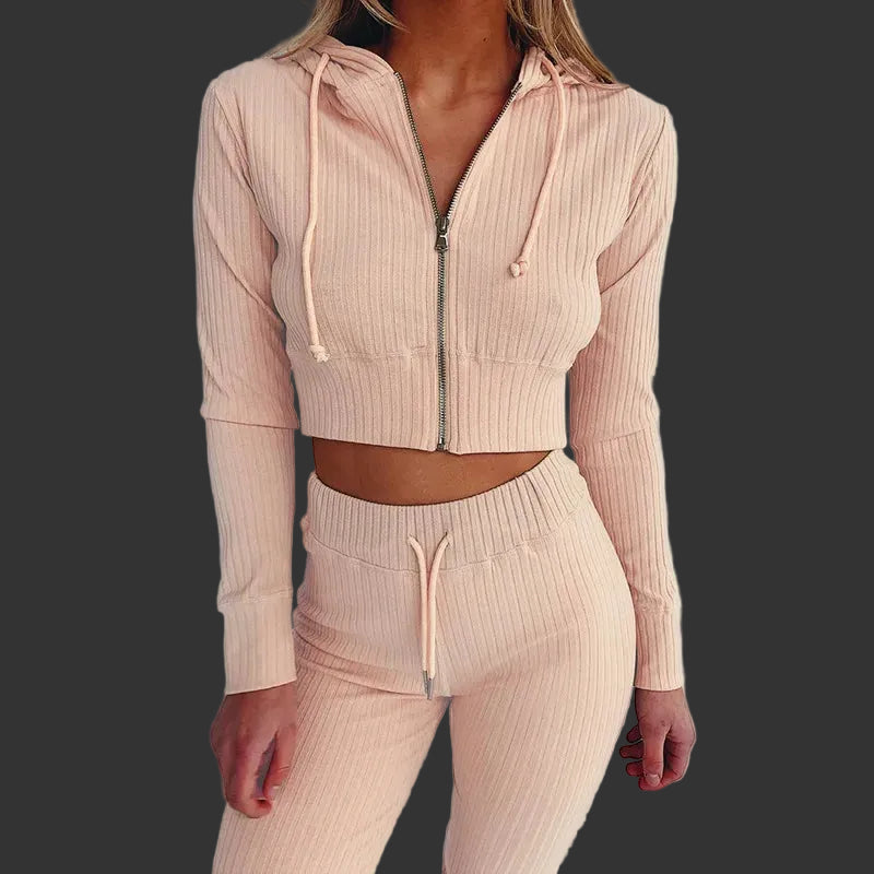 Beige ribbed knit hoodie and pants set on a plain background