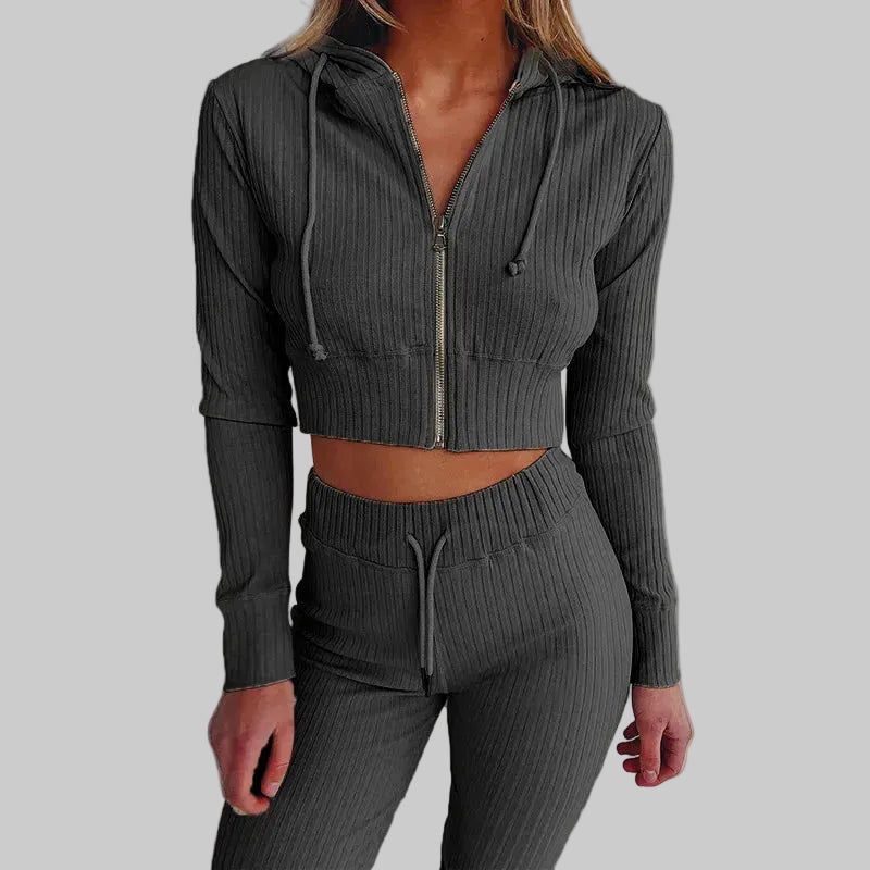 Person wearing a gray ribbed knit two-piece set against a plain background