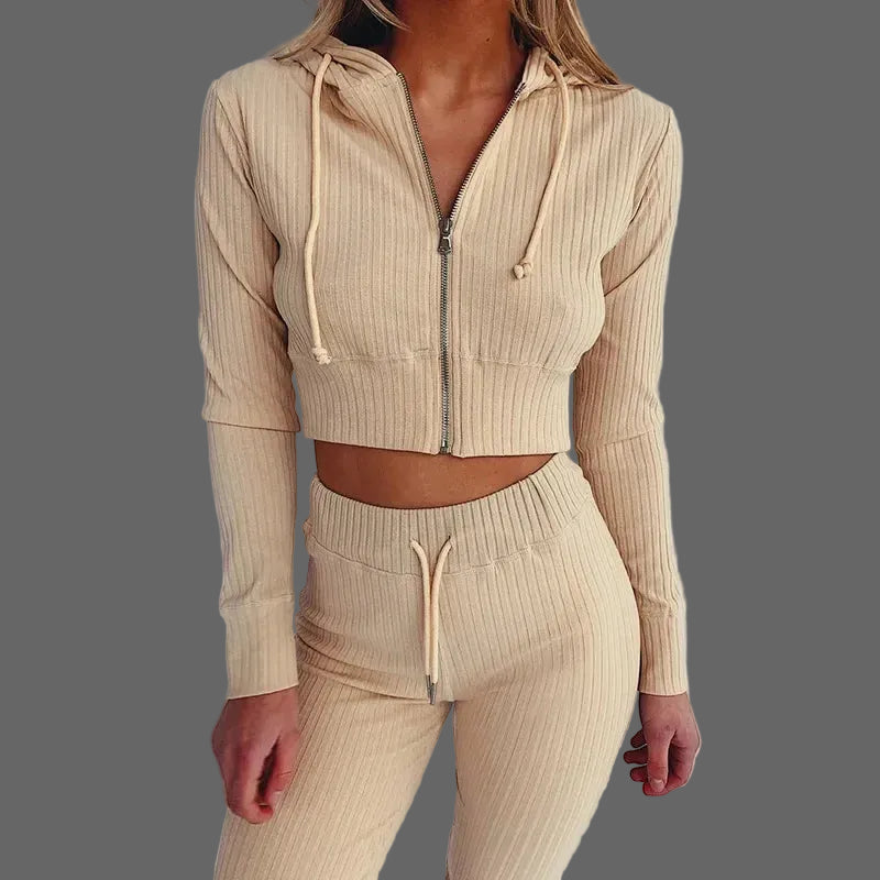 Beige ribbed knit hoodie and pants set on a plain background