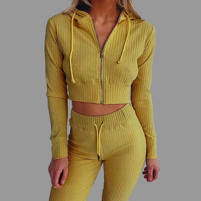 Yellow ribbed tracksuit worn by a person on a white background