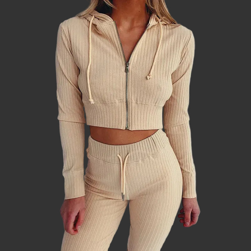 Beige ribbed knit hoodie and pants set on a plain background
