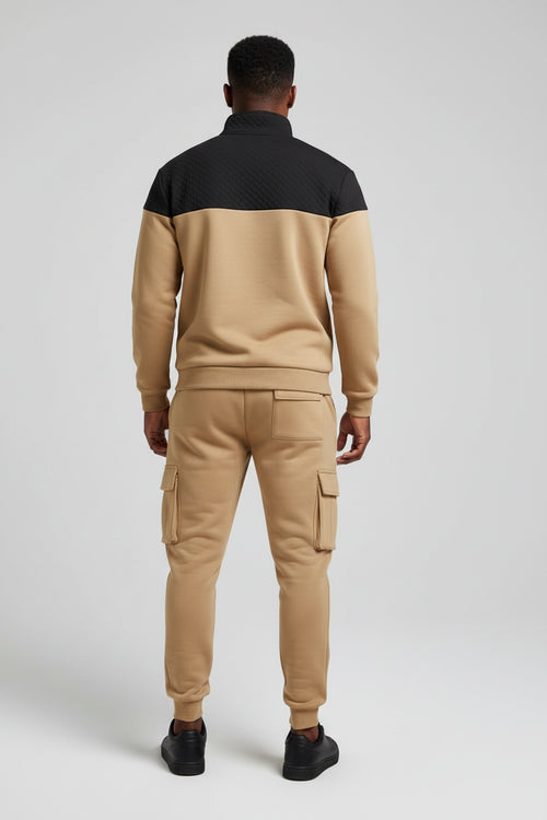 Two-tone tracksuit with black and beige design on a white background