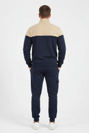Navy and beige tracksuit on a white background