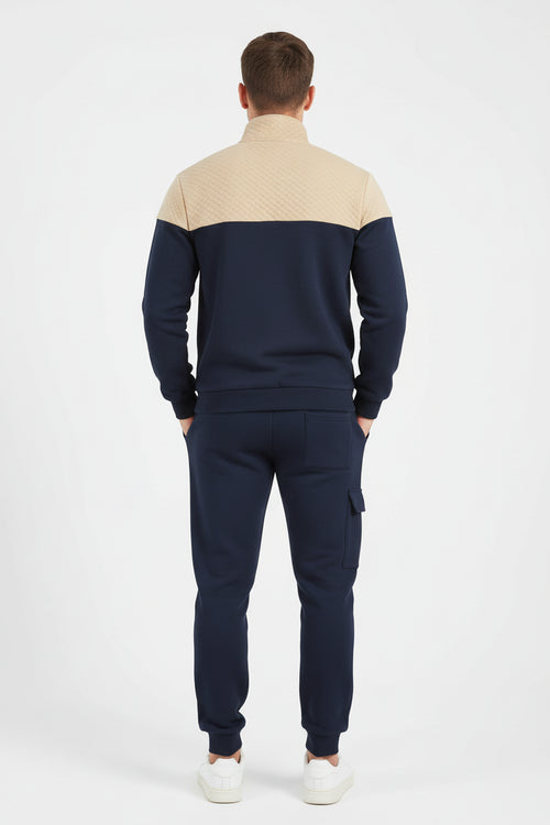 Navy and beige tracksuit on a white background