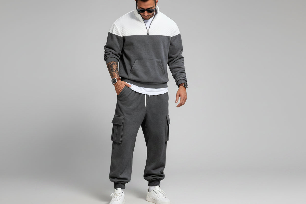 Man in gray tracksuit with white top 