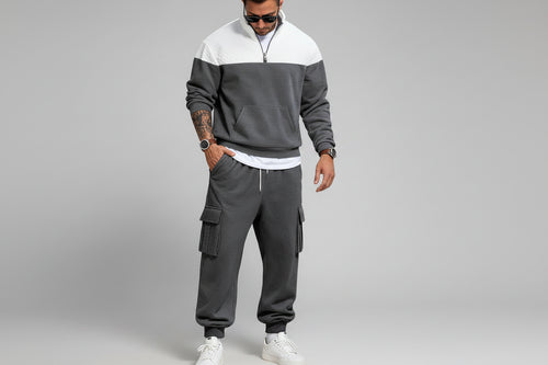 Man in gray tracksuit with white top 