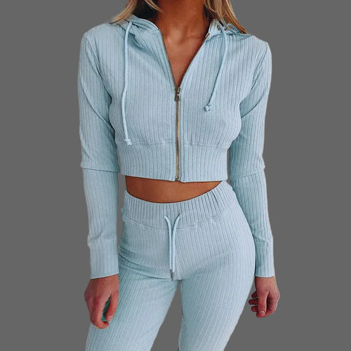 Light blue ribbed hoodie and pants set on a plain background