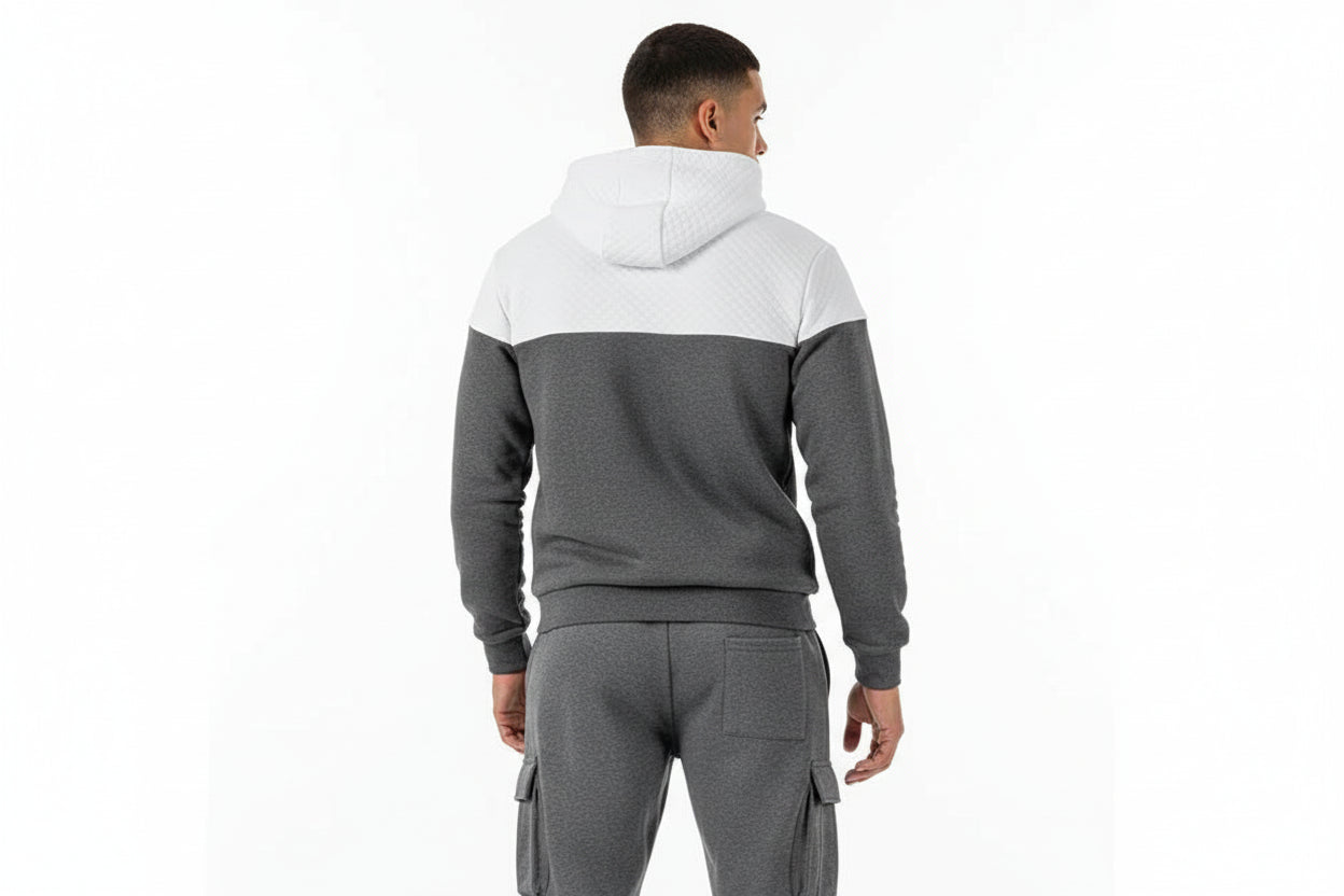 Gray and white color-blocked hoodie and pants set on a white background