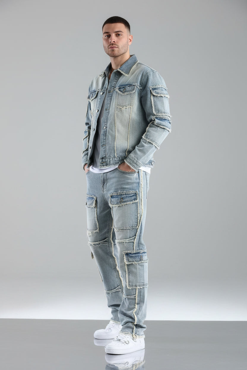 Person wearing a patchwork denim outfit on a gray background