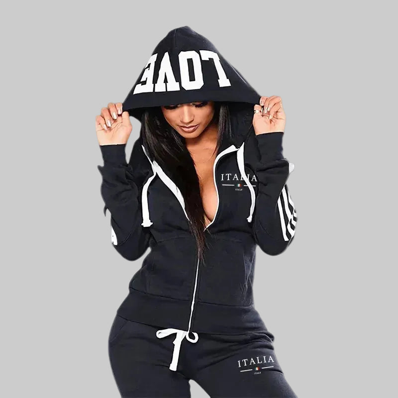 Person wearing a black hoodie with 'ITALIA' branding on a white background