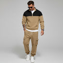 Man in beige tracksuit with a light gray background