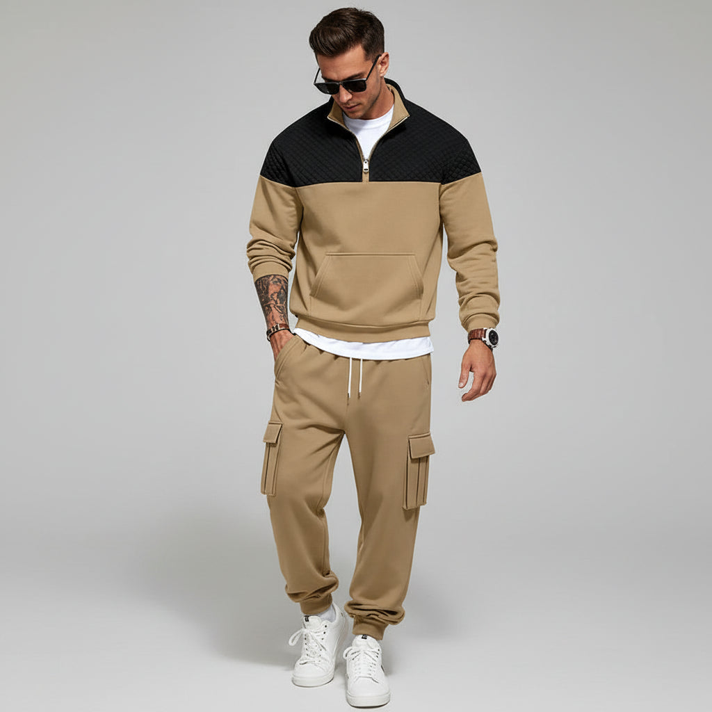 Man in beige tracksuit with a light gray background