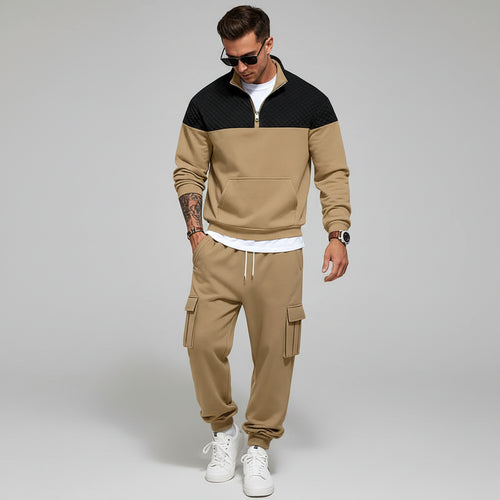 Man in beige tracksuit with a light gray background